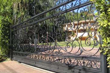 Ornamental wrought iron slide gate