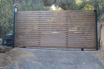 Slide gate with horizontal Ipe boards.